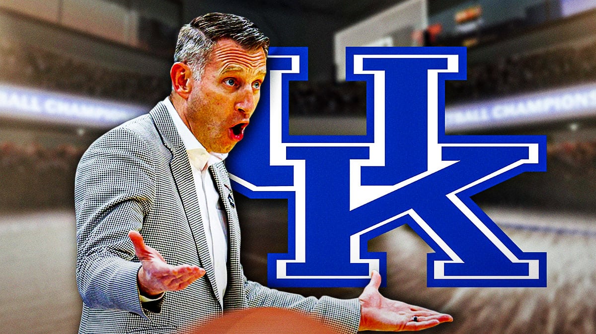 Nate Oats standing next to Kentucky logo
