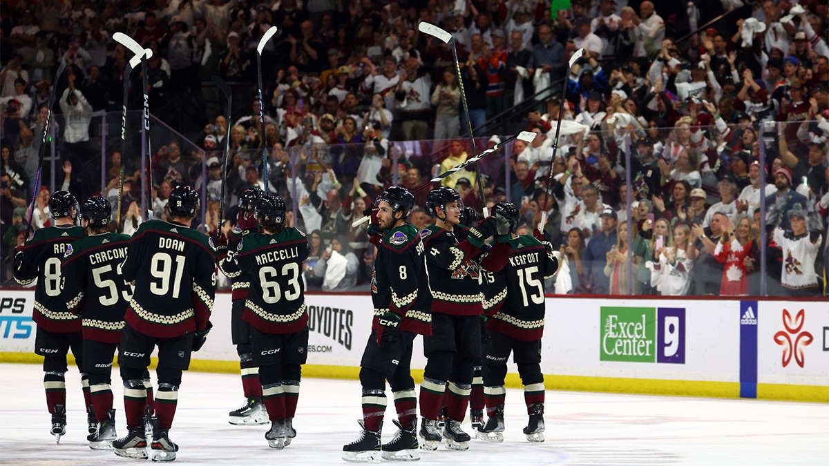  Arizona Coyotes players salute the fans in the crowd following the game against the Edmonton Oilers at Mullett Arena. 