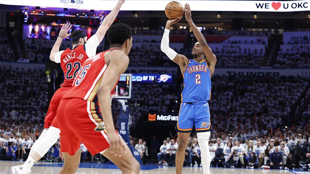 Oklahoma City Thunder guard Shai Gilgeous-Alexander (2) shoots a three-point basket as New Orleans Pelicans forward Larry Nance Jr. (22) comes in to defend during the second half of game two of the first round for the 2024 NBA playoffs at Paycom Center. 