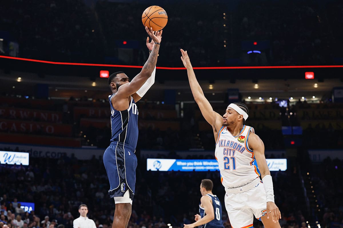 Dallas Mavericks forward Tim Hardaway Jr. (10) shoots a three point basket as Oklahoma City Thunder guard Aaron Wiggins (21) defends during the first half at Paycom Center. 
