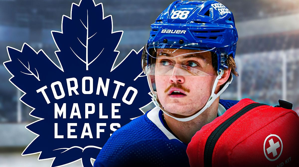 William Nylander in middle of image looking stern with first aid kit in image, Toronto Maple Leafs logo, hockey rink in background