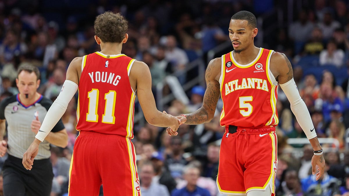 Atlanta Hawks guard Dejounte Murray (5) and guard Trae Young (11) react after timeout against the Orlando Magic in the fourth quarter at Amway Center.