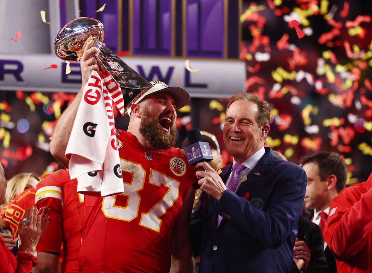 Kansas City Chiefs tight end Travis Kelce (87) celebrates with the Vince Lombardi Trophy after defeating the San Francisco 49ers in Super Bowl LVIII at Allegiant Stadium.