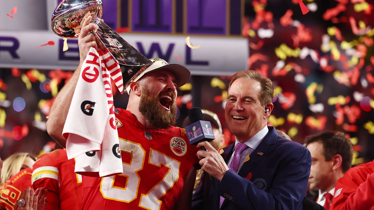 Kansas City Chiefs tight end Travis Kelce (87) celebrates with the Vince Lombardi Trophy after defeating the San Francisco 49ers in Super Bowl LVIII at Allegiant Stadium.