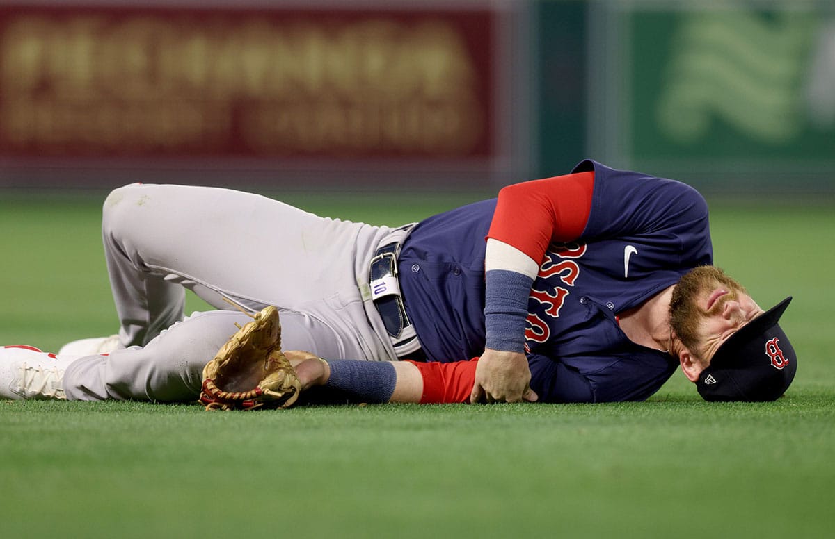 Boston Red Sox shortstop Trevor Story (10) reacts after an injury during the fourth inning against the Los Angeles Angels at Angel Stadium.
