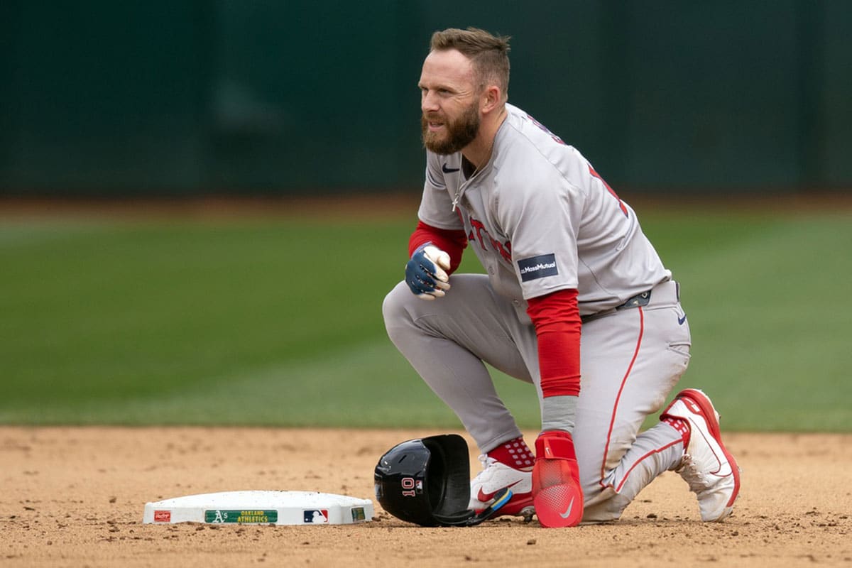Boston Red Sox shortstop Trevor Story (10) sits by second base after being forced out to end the eighth inning against the Oakland Athletics at Oakland-Alameda County Coliseum