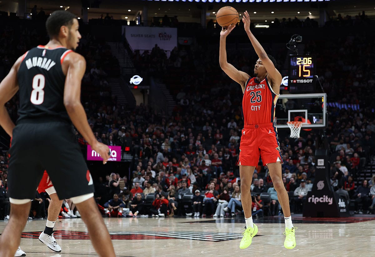  New Orleans Pelicans guard Trey Murphy III (25) shoots the ball as Portland Trail Blazers forward Kris Murray (8) watches in the second quarter at Moda Center.