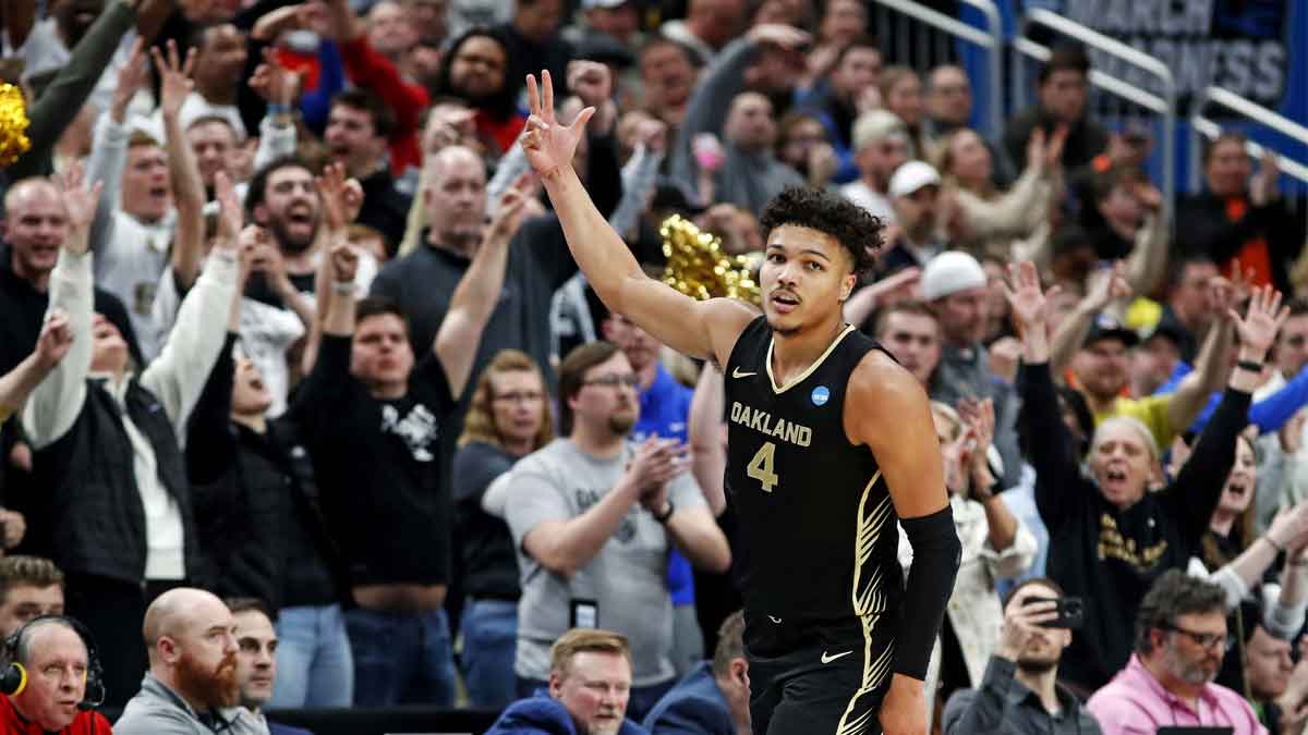 Oakland Golden Grizzlies forward Trey Townsend (4) celebrates after making a three pointer during the second half of the against the North Carolina State Wolfpack in the second round of the 2024 NCAA Tournament at PPG Paints Arena.