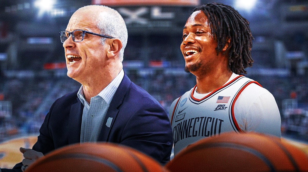 Tristen Newton smiling. Dan Hurley next to him