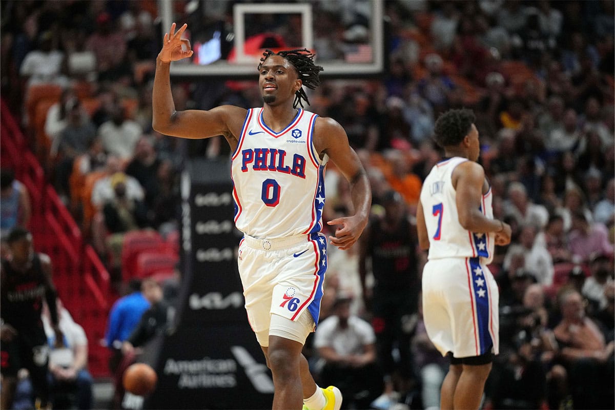 Philadelphia 76ers guard Tyrese Maxey (0) celebrates a three-point shot against the Miami Heat during the first half at Kaseya Center.