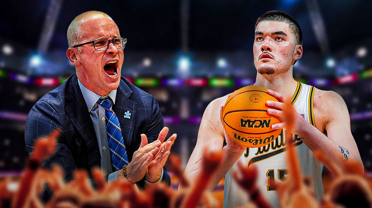 UConn coach Dan Hurley on the left, clapping for Zach Edey on the right.