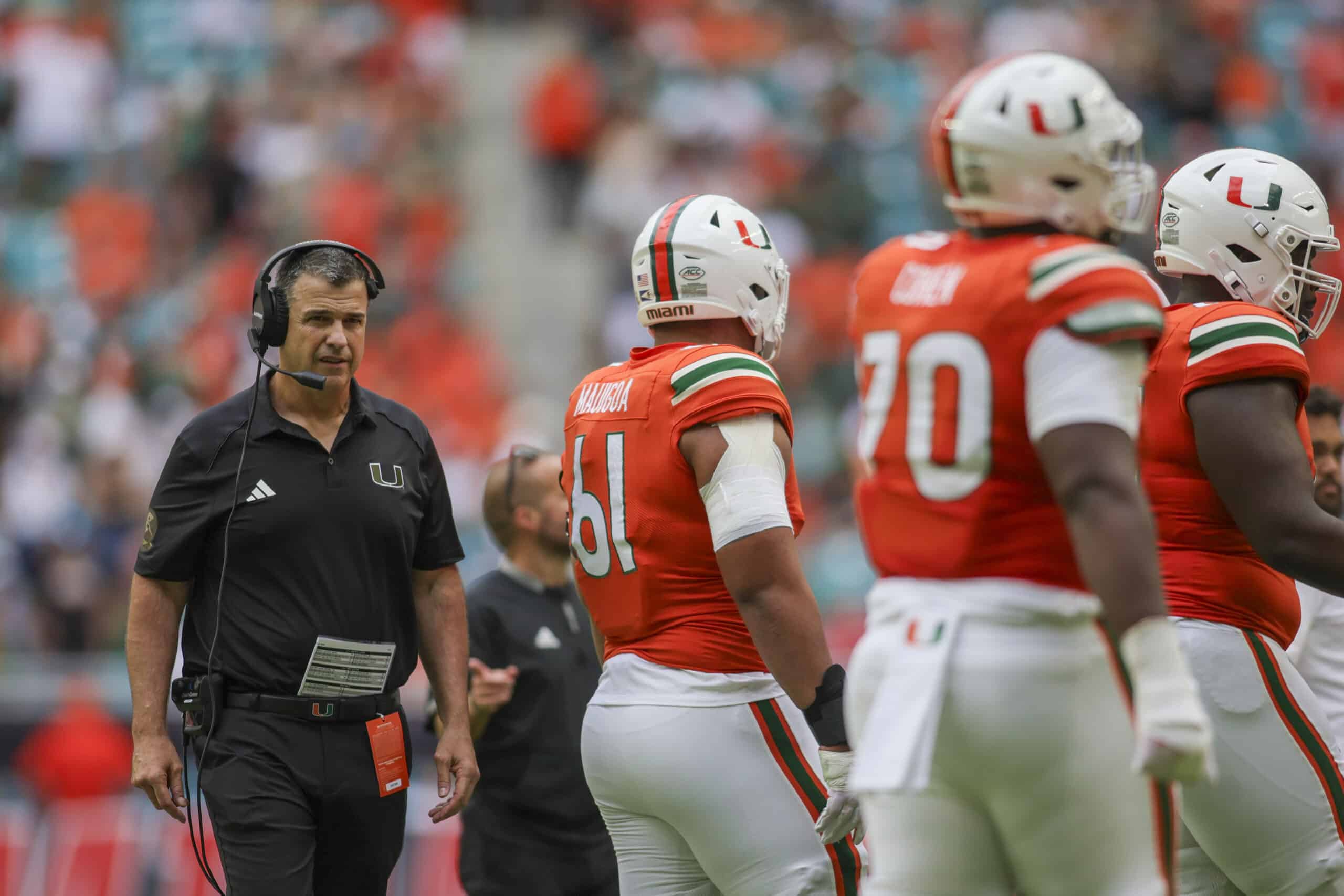 Nov 18, 2023; Miami Gardens, Florida, USA; Miami Hurricanes head coach Mario Cristobal looks on from the field against the Louisville Cardinals during the third quarter at Hard Rock Stadium. 