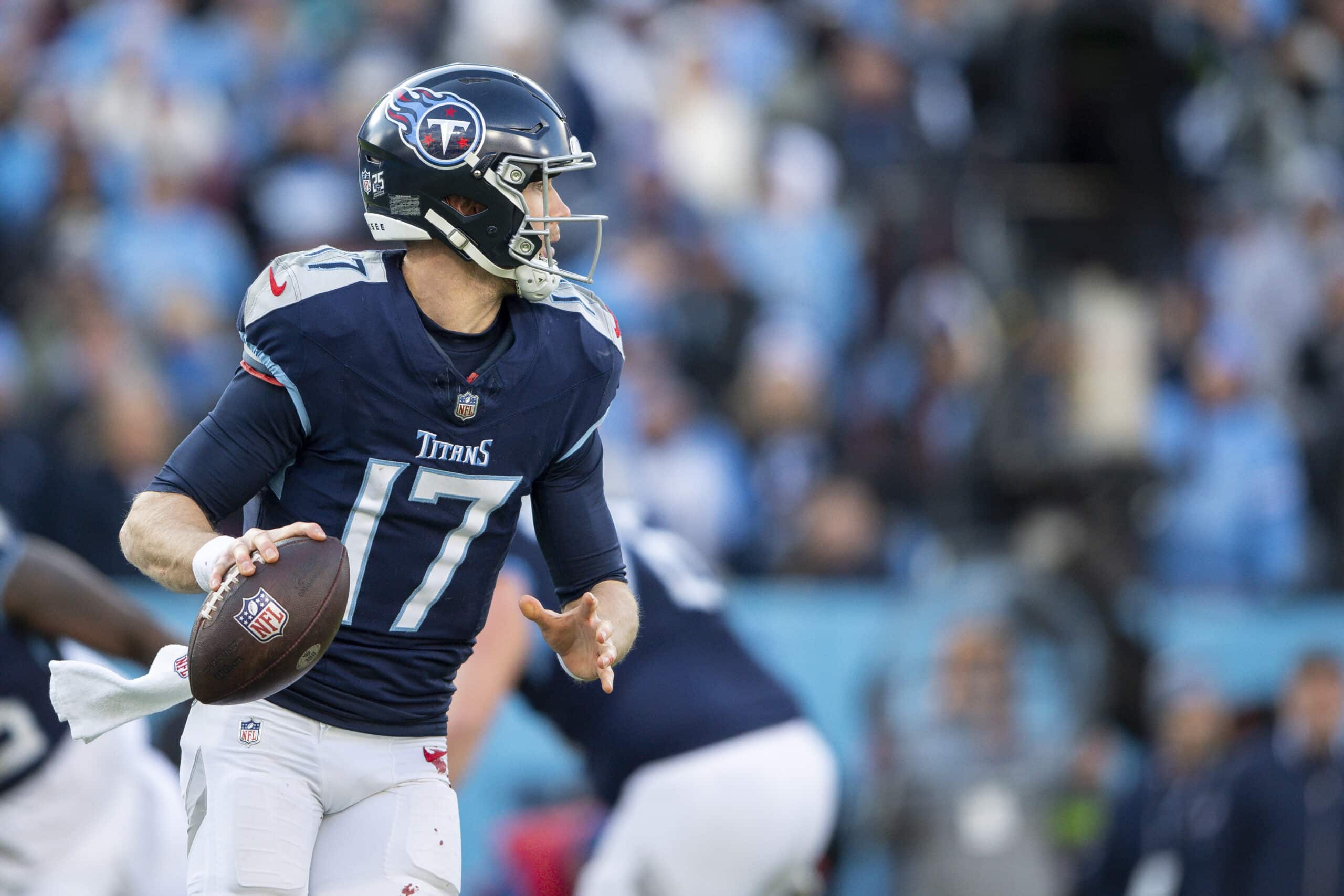 Jan 7, 2024; Nashville, Tennessee, USA; Tennessee Titans quarterback Ryan Tannehill (17) rolls out against the Jacksonville Jaguars during the second half at Nissan Stadium. 