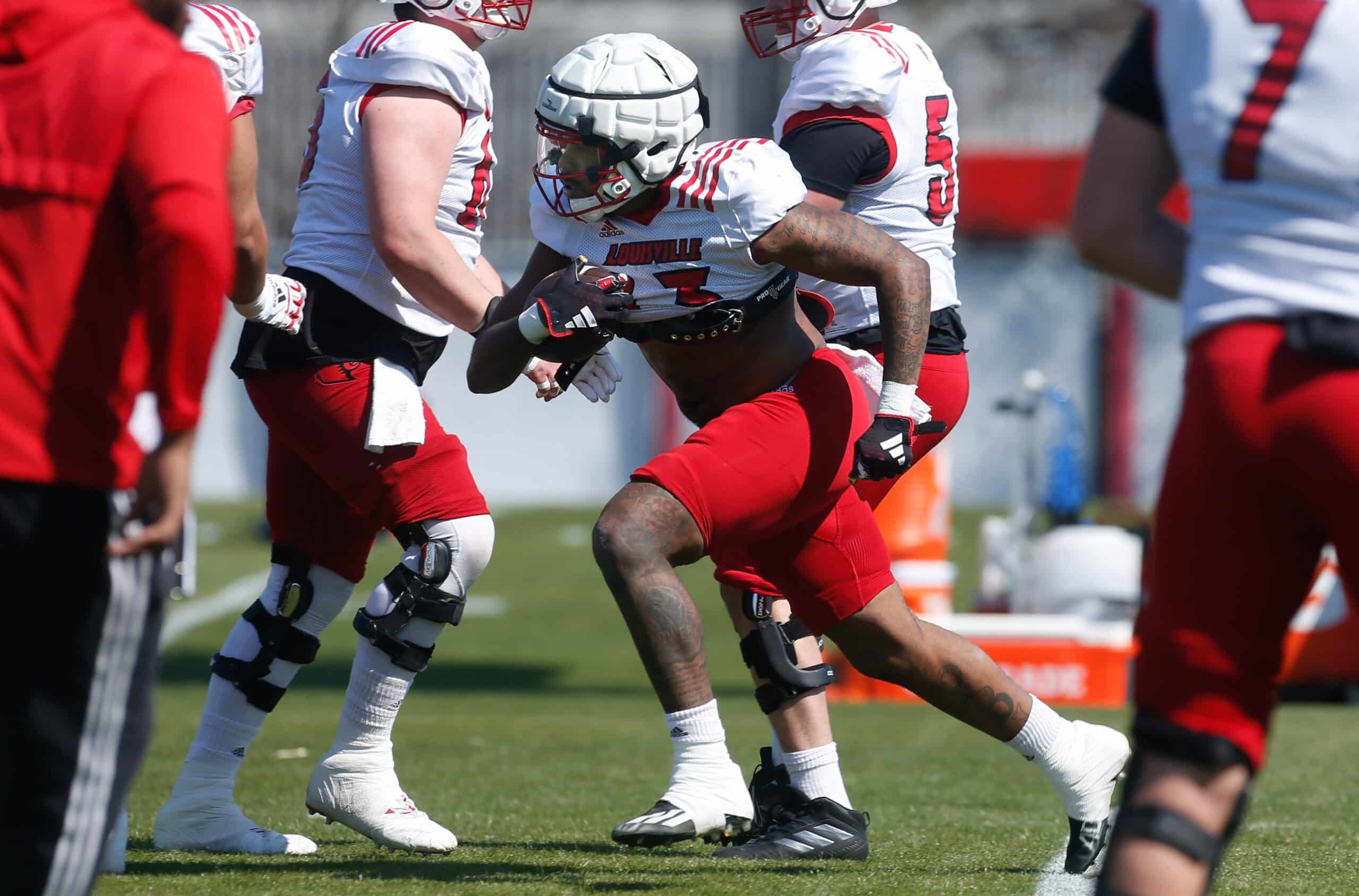 Louisville’s Peny Boone ran the ball during spring practice Friday afternoon. Mar. 29, 2024