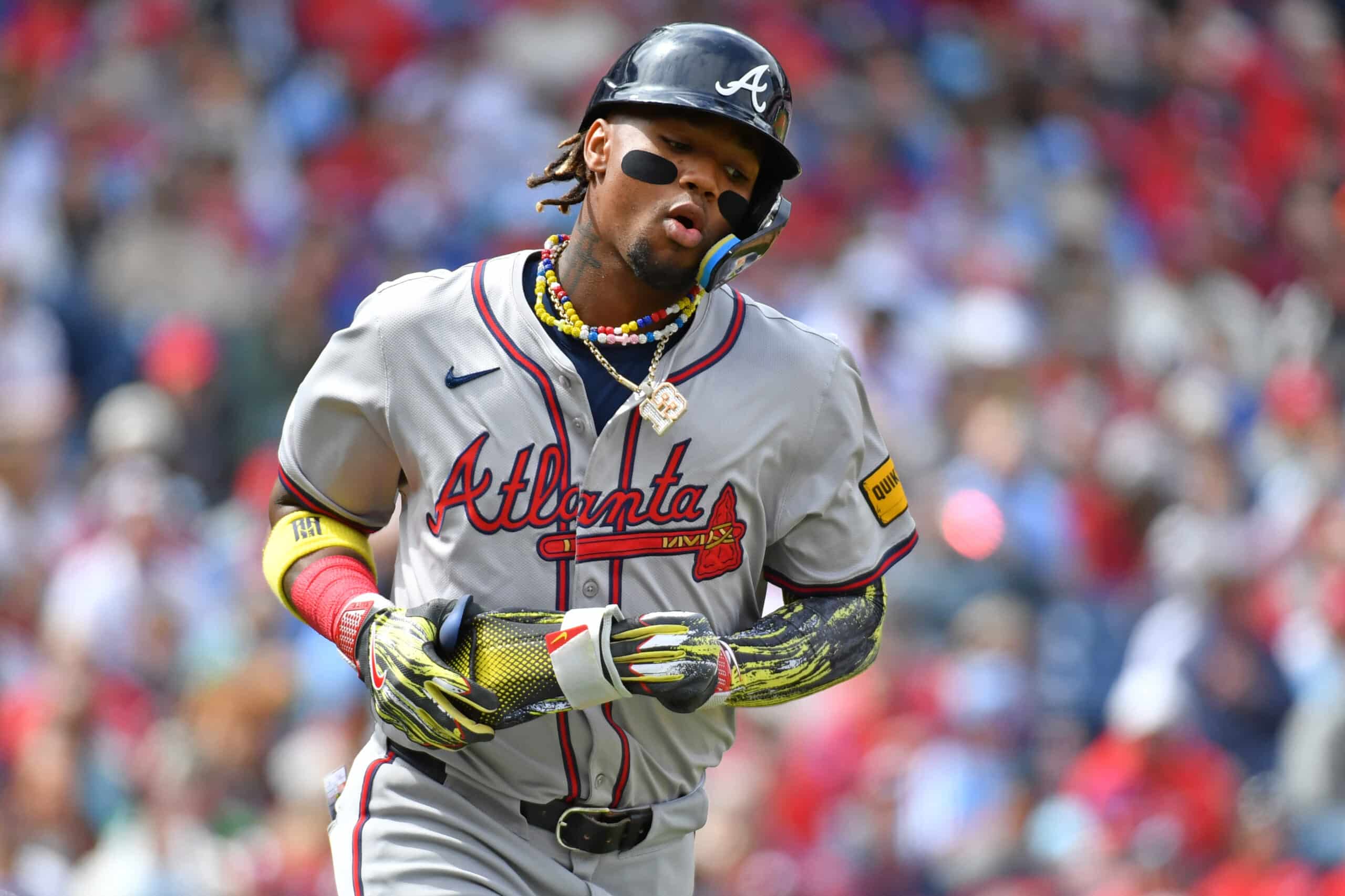 Mar 31, 2024; Philadelphia, Pennsylvania, USA; Atlanta Braves right fielder Ronald Acuna, Jr (13) runs to first base after drawing a walk during the first inning against the Philadelphia Phillies at Citizens Bank Park. 