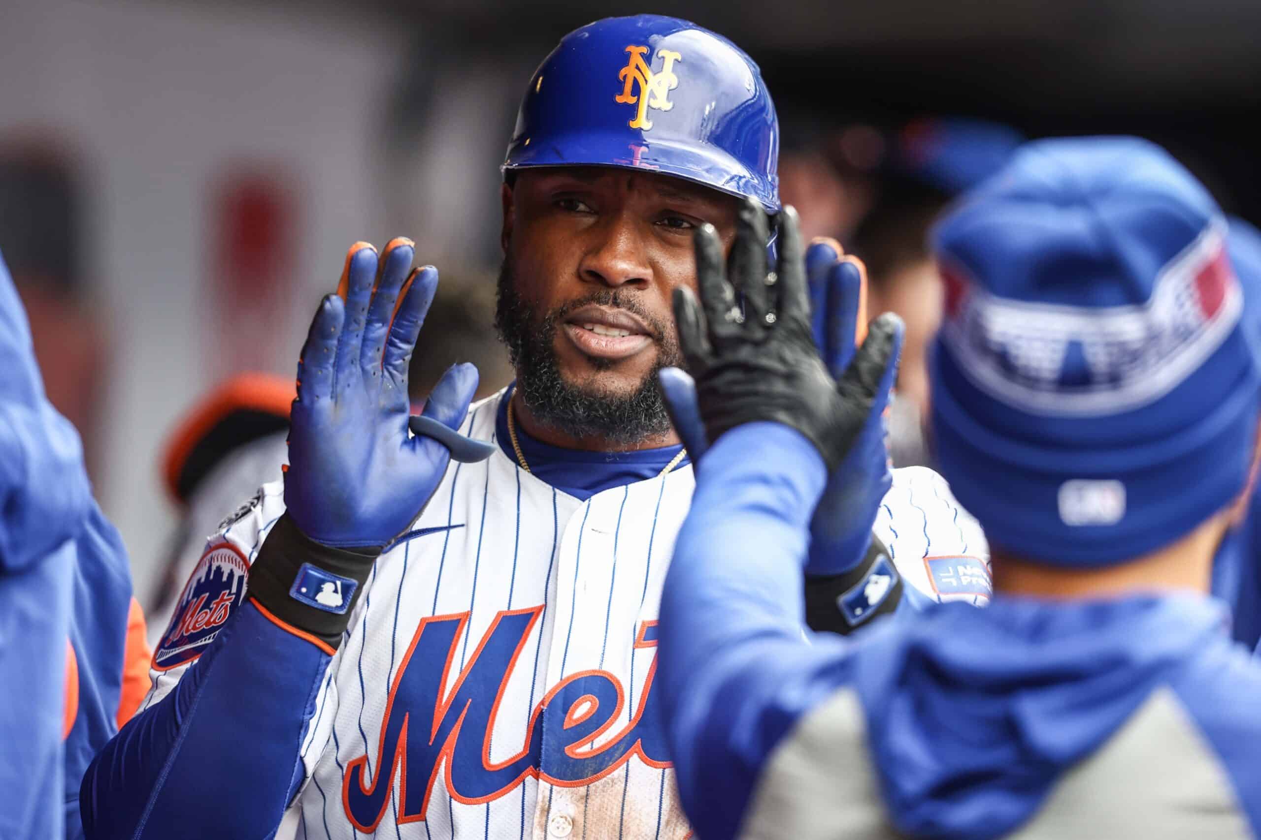 Apr 13, 2024; New York City, New York, USA; New York Mets right fielder Starling Marte (6) is greeted in the dugout after hitting a solo home run in the eighth inning against the Kansas City Royals at Citi Field.