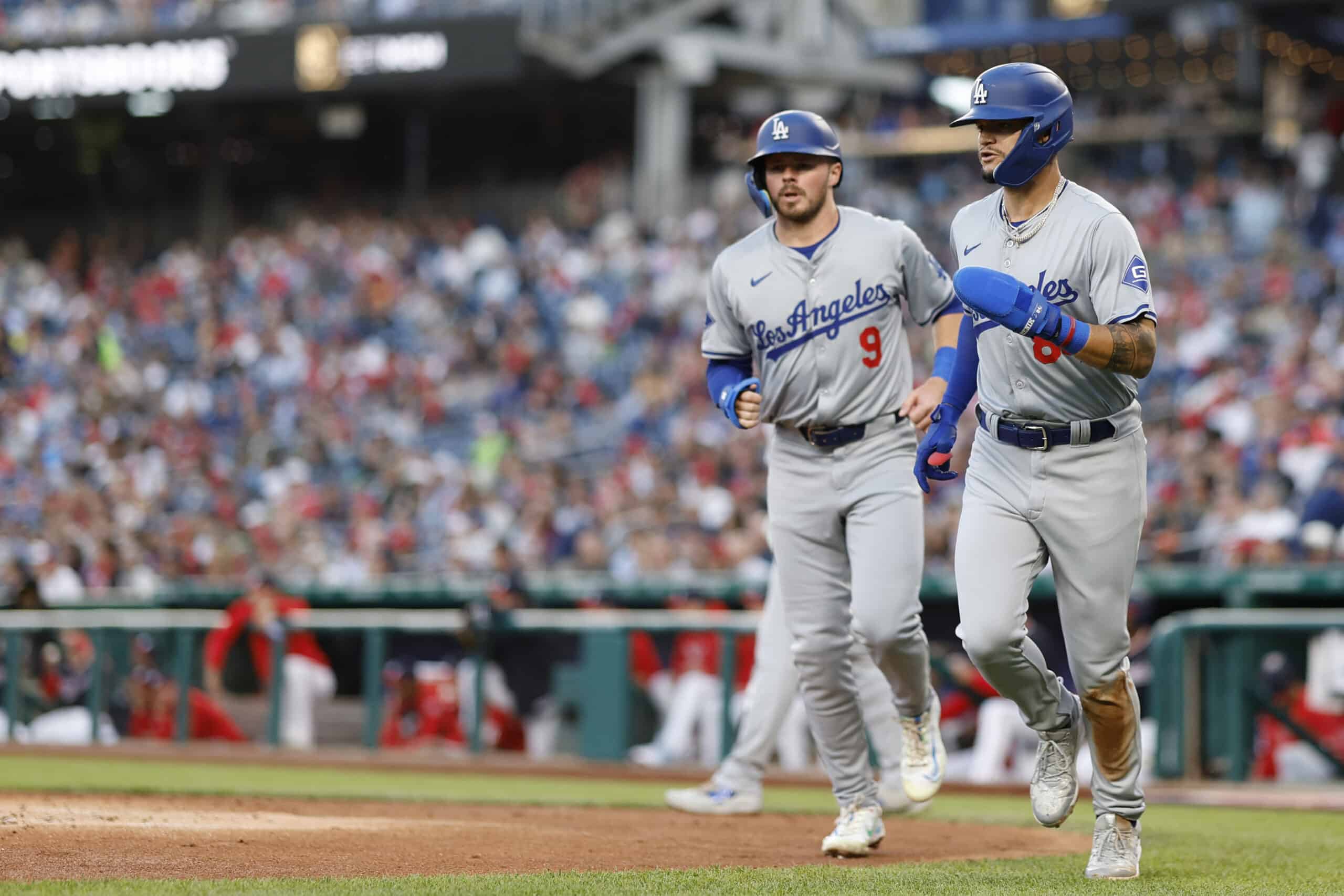 Apr 24, 2024; Washington, District of Columbia, USA; Los Angeles Dodgers second baseman Gavin Lux (9) and Dodgers outfielder Andy Pages (84) celebrate after scoring runs on a two run single by Dodgers shortstop Mookie Betts (not pictured) against the Washington Nationals during the second inning at Nationals Park. 