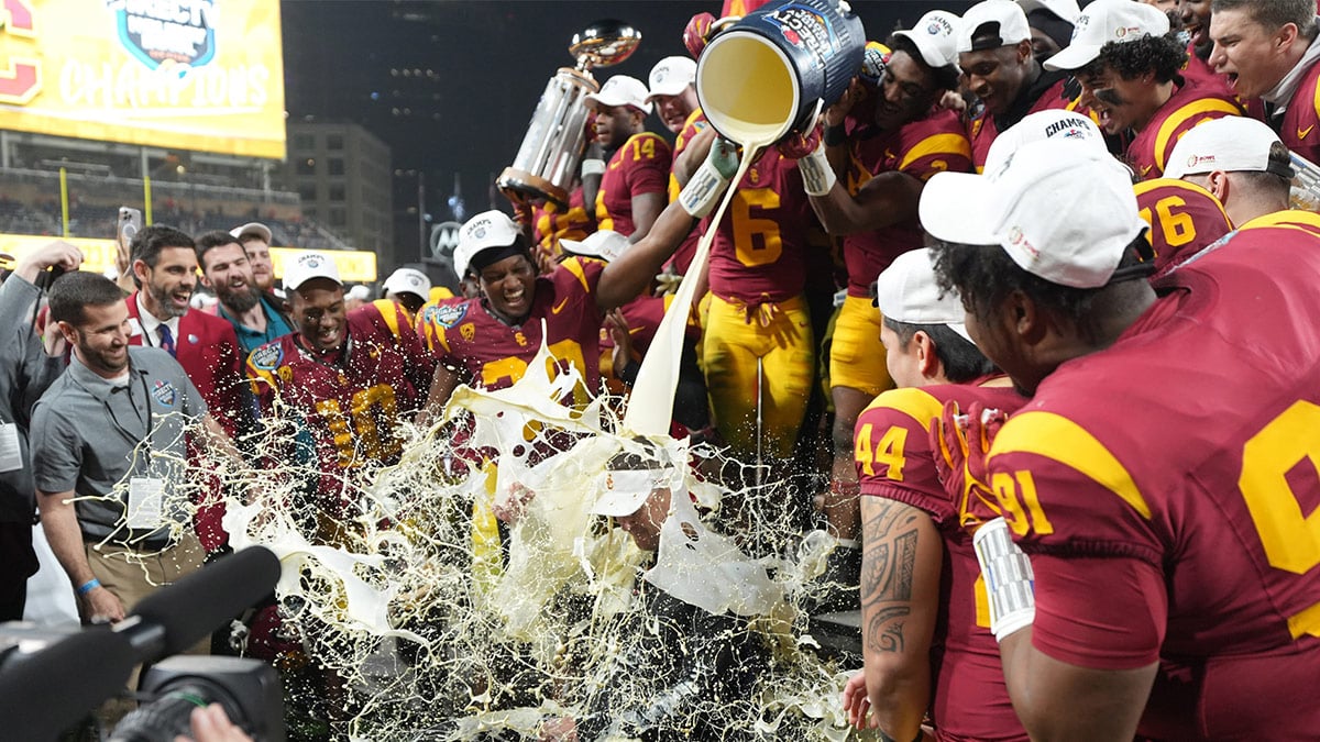 Southern California Trojans head coach Lincoln Riley is doused with eggnog after the Holiday Bowl against the Louisville Cardinals at Petco Park