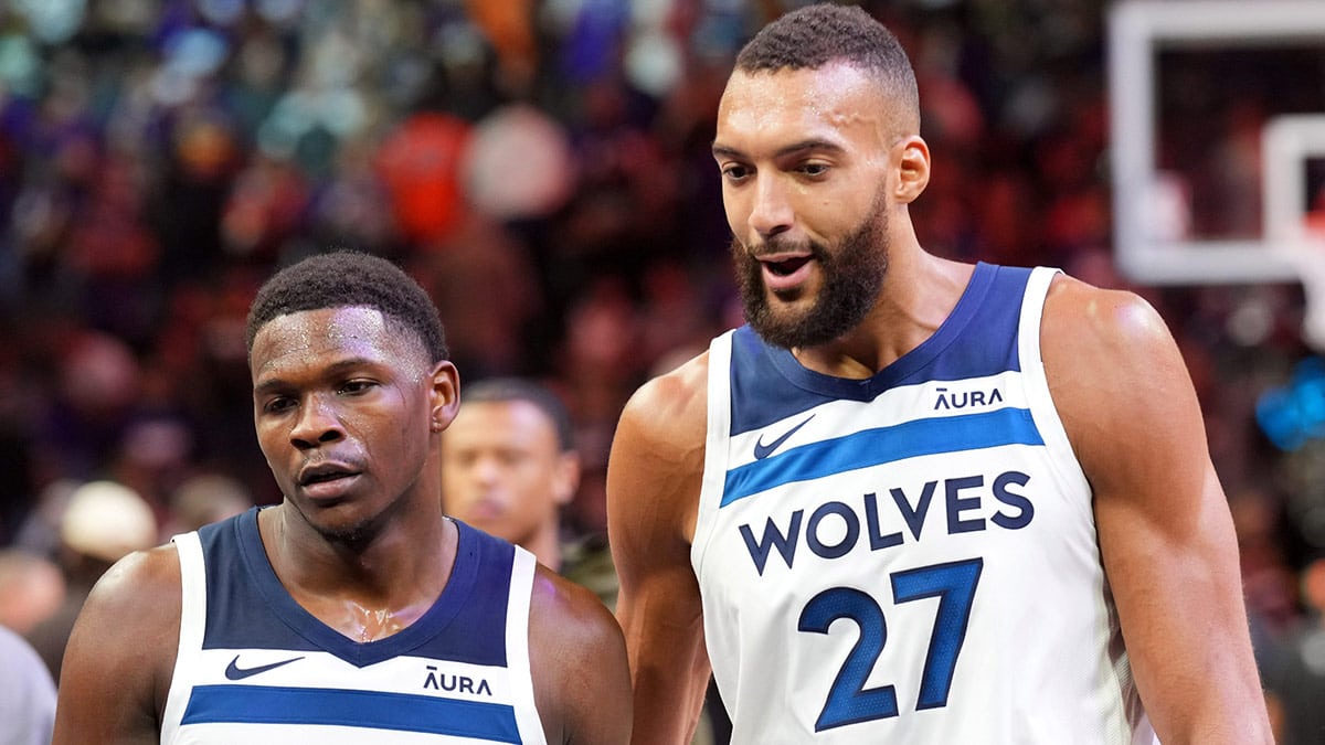 Minnesota Timberwolves guard Anthony Edwards (5) and Minnesota Timberwolves center Rudy Gobert (27) talk during the first half of game three of the first round for the 2024 NBA playoffs against the Phoenix Suns at Footprint Center.
