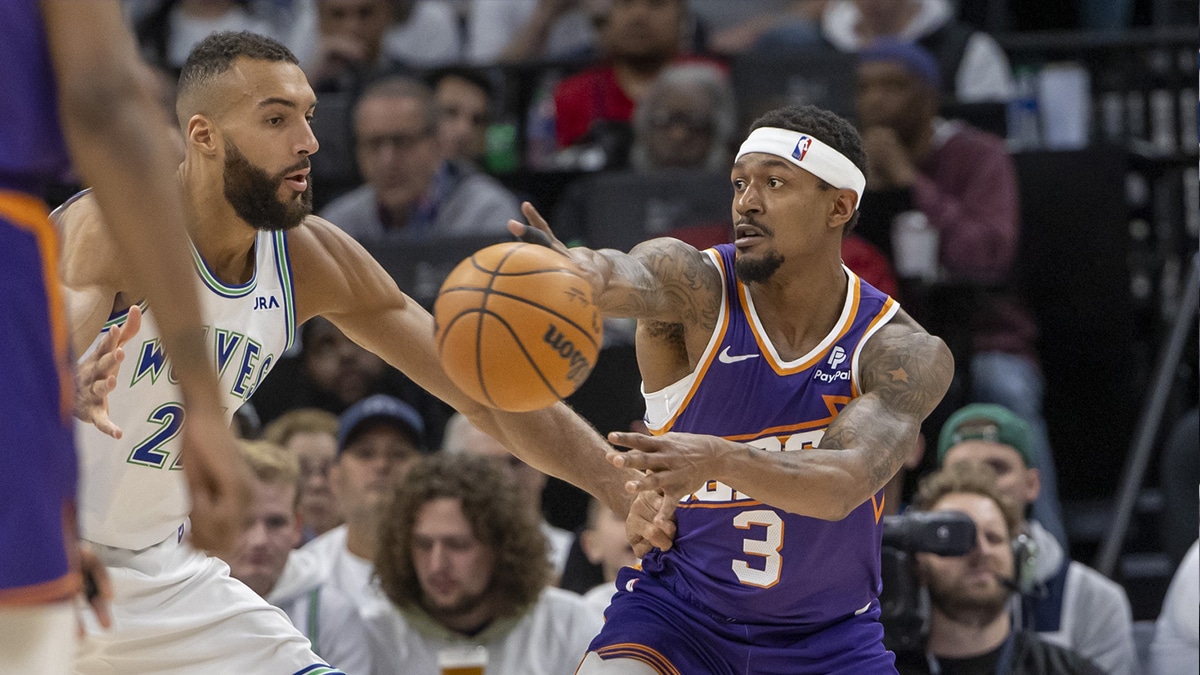 Phoenix Suns guard Bradley Beal (3) passes the ball as Minnesota Timberwolves center Rudy Gobert (27) plays defense in the second half during game one of the first round for the 2024 NBA playoffs at Target Center. 