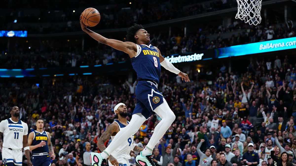 Denver Nuggets forward Peyton Watson (8) prepares to dunk ball in the fourth quarter against the Minnesota Timberwolves at Ball Arena.