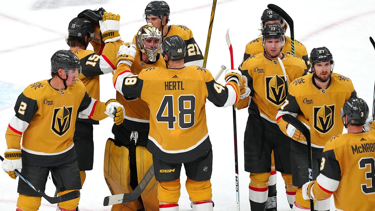 Vegas Golden Knights players celebrate after defeating the Minnesota Wild 7-2 to clench the final playoff position in the Western Conference at T-Mobile Arena. 