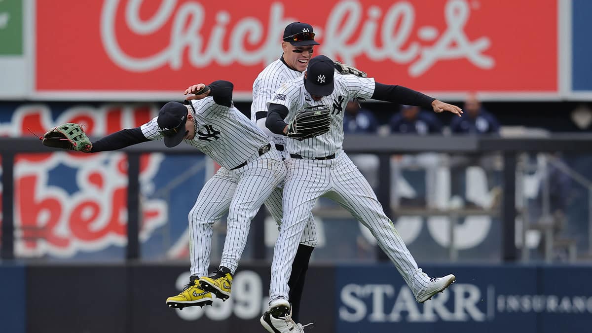 New York Yankees left fielder Alex Verdugo (24) and center fielder Aaron Judge (99) and right fielder Juan Soto (22) celebrate after defeating the Tampa Bay Rays at Yankee Stadium.