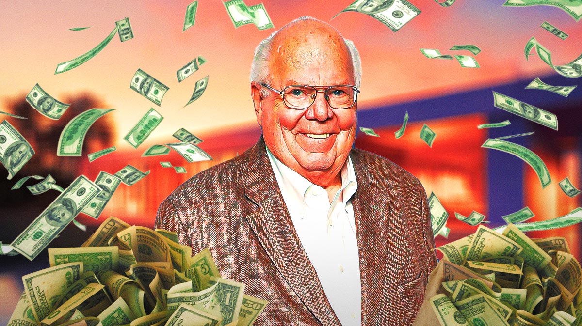 Verne Lundquist with money all around him.