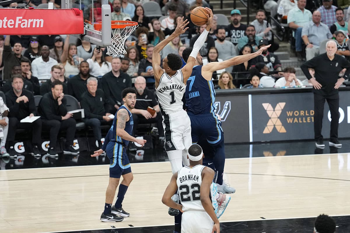 San Antonio Spurs center Victor Wembanyama (1) goes in for a dunk against Memphis Grizzlies forward Santi Aldama (7) in the second half at Frost Bank Center.