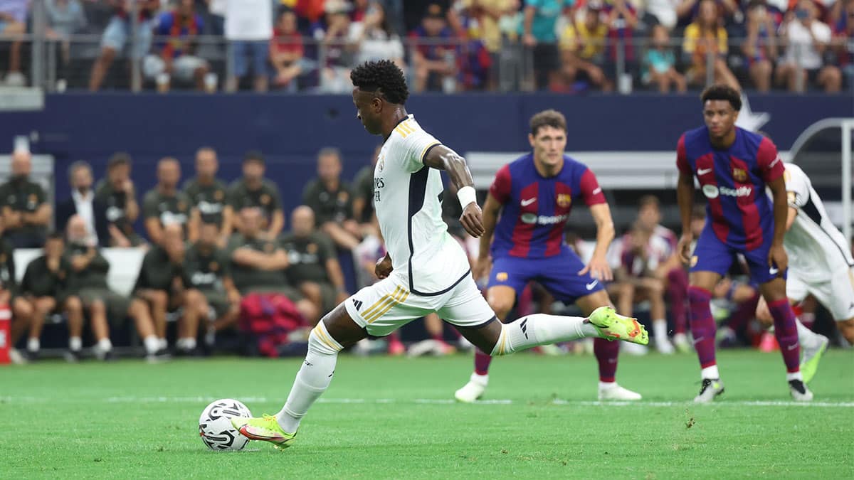 Real Madrid forward Vinicius Junior (7) misses a penalty shot during the first half against FC Barcelona at AT&T Stadium.