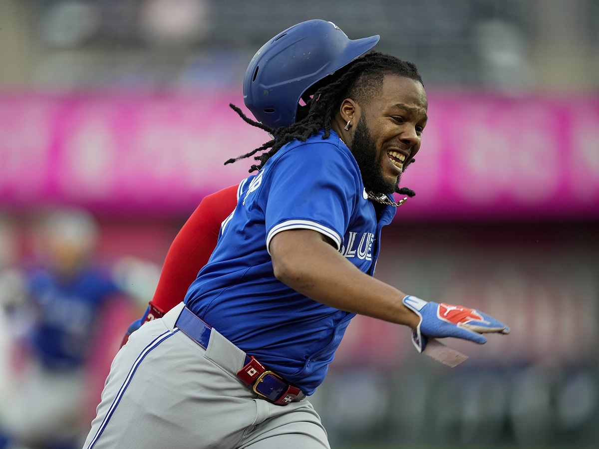 Toronto Blue Jays first base Vladimir Guerrero Jr. (27) loses his helmet as he rounds third base during the third inning against the Kansas City Royals at Kauffman Stadium.