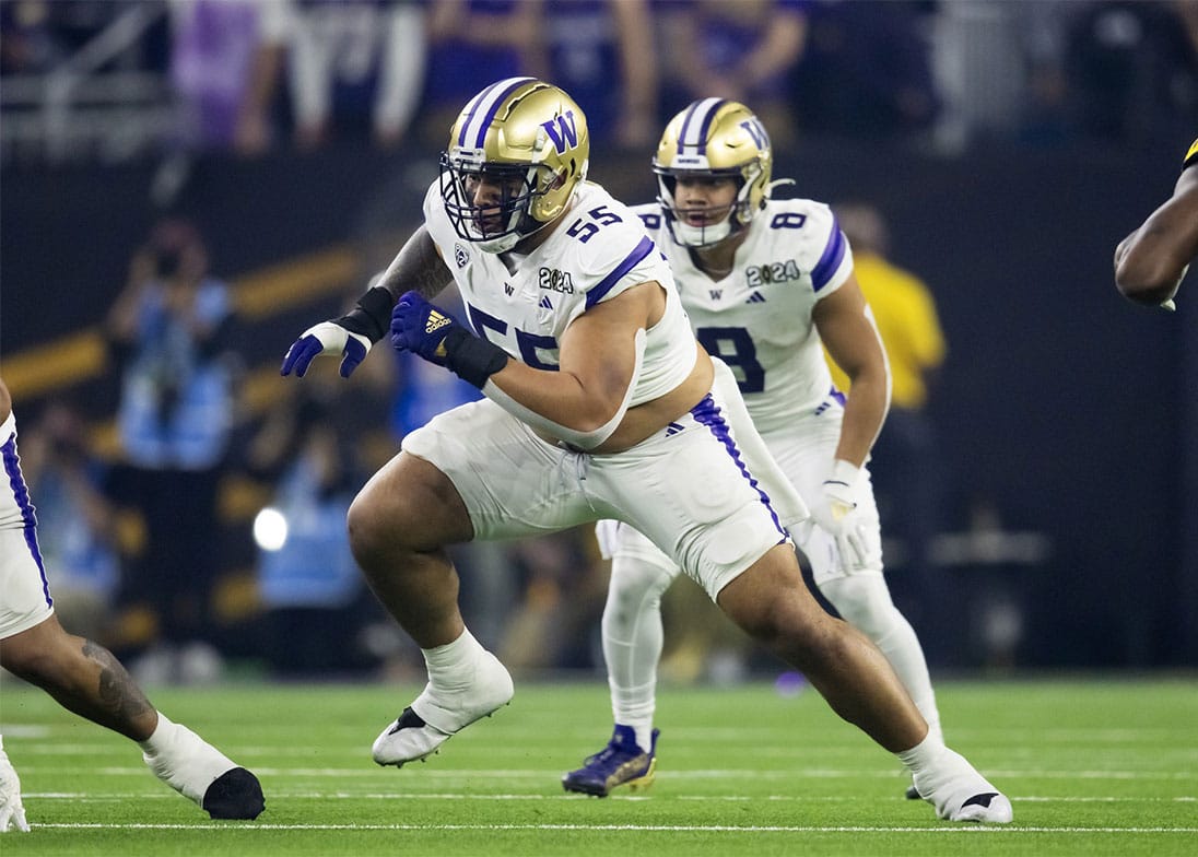 Washington Huskies offensive lineman Troy Fautanu (55) against the Michigan Wolverines during the 2024 College Football Playoff national championship game at NRG Stadium. 
