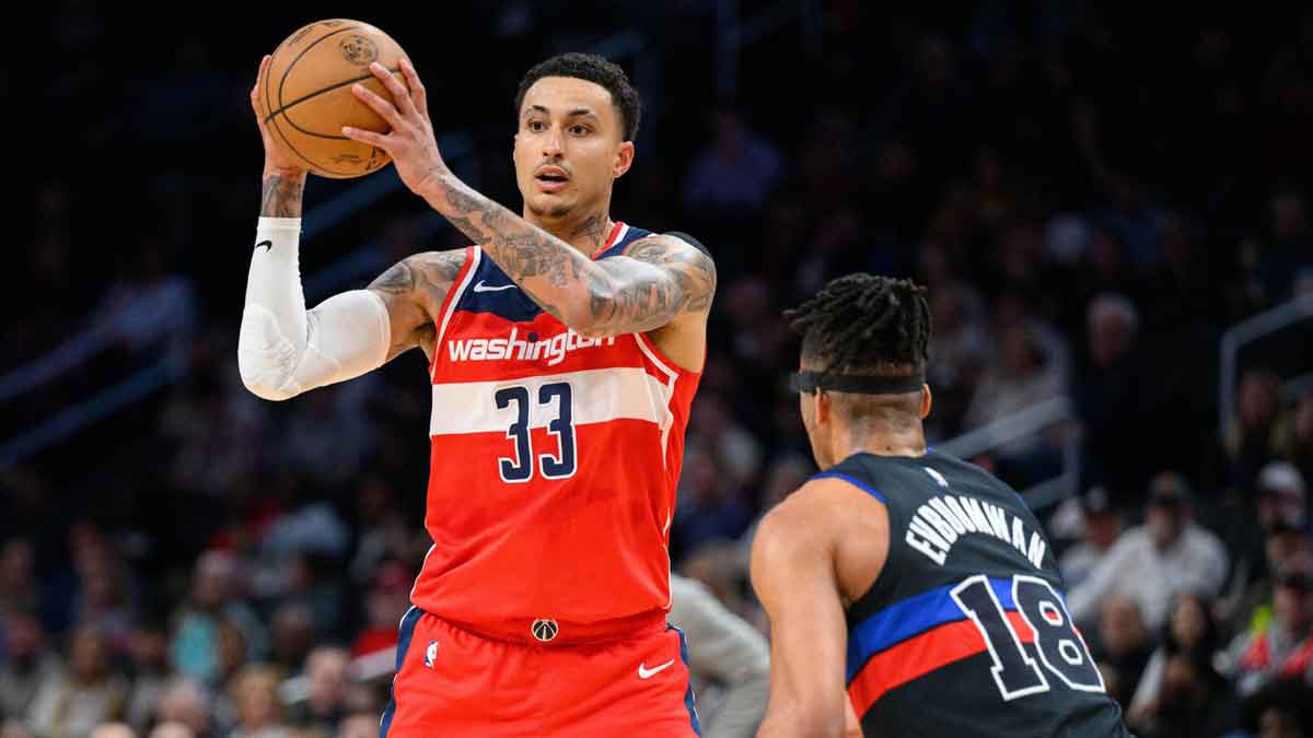 Washington Wizards forward Kyle Kuzma (33) looks to pass against Detroit Pistons forward Tosan Evbuomwan (18) during the first quarter at Capital One Arena