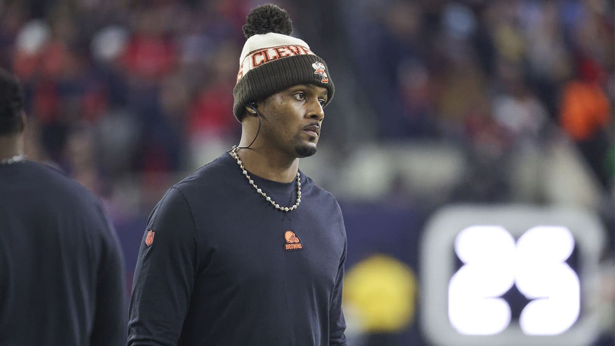 Cleveland Browns quarterback Deshaun Watson looks on from the sideline in a 2024 AFC wild card game against the Houston Texans at NRG Stadium