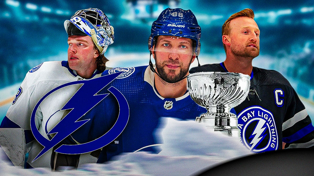 Nikita Kucherov in middle, Andrei Vasilevskiy and Steven Stamkos on either side, TB Lightning logo, hockey rink in background, Stanley Cup in image