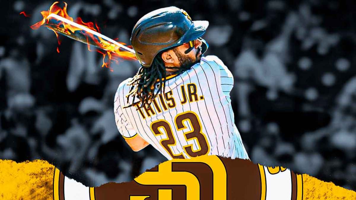 Fernando Tatis Jr. swinging a baseball bat with fire coming off the bat.