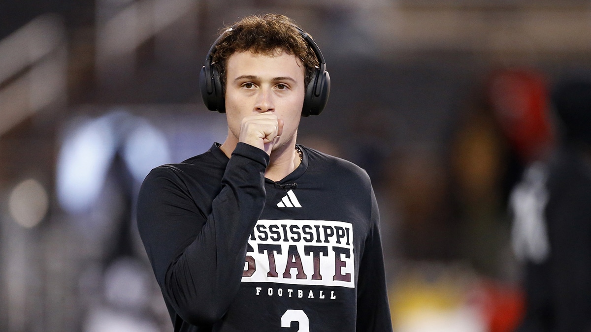 Mississippi State Bulldogs quarterback Will Rogers (2) breathes on his hands to warm them up prior to the game at Davis Wade Stadium at Scott Field.