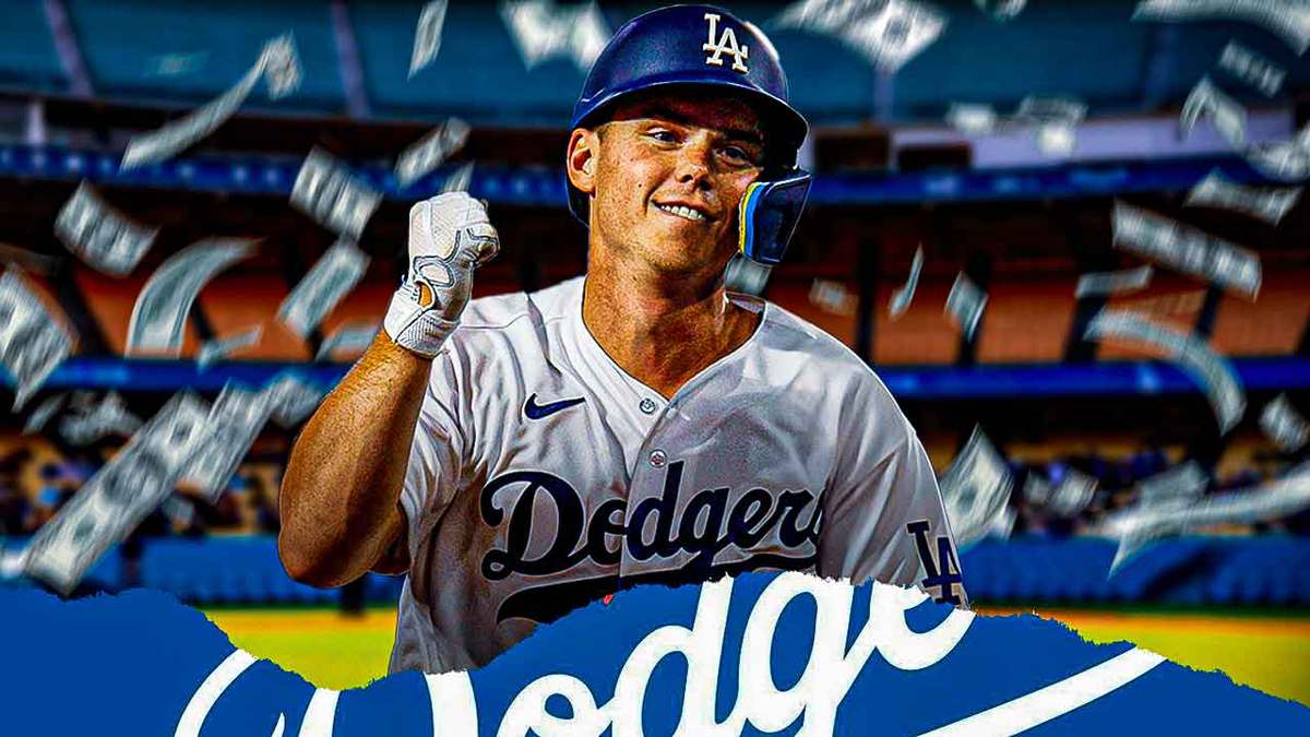 Dodgers' Will Smith smiling with money falling down around him. Dodger Stadium background.