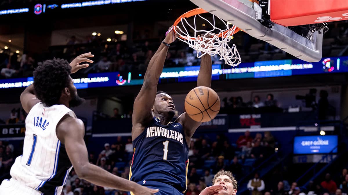 New Orleans Pelicans forward Zion Williamson (1) dunks the ball against Orlando Magic forward Jonathan Isaac (1) during the second half at Smoothie King Center.