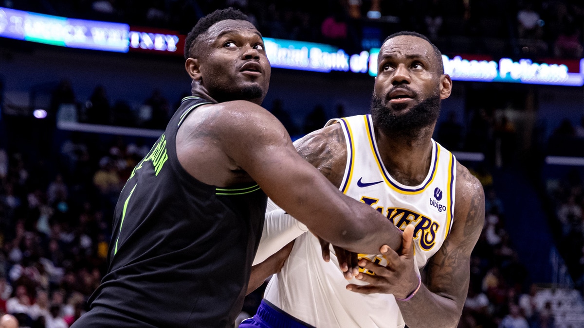 Los Angeles Lakers forward LeBron James (23) and New Orleans Pelicans forward Zion Williamson (1) fight for position during the second half at Smoothie King Center. 