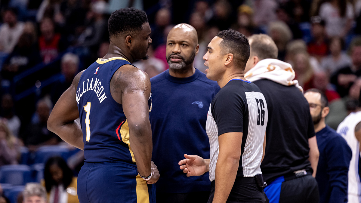 New Orleans Pelicans forward Zion Williamson (1) complains to referee John Conley (56) and Orlando Magic head coach Jamahl Mosley about a play during the second half at Smoothie King Center.