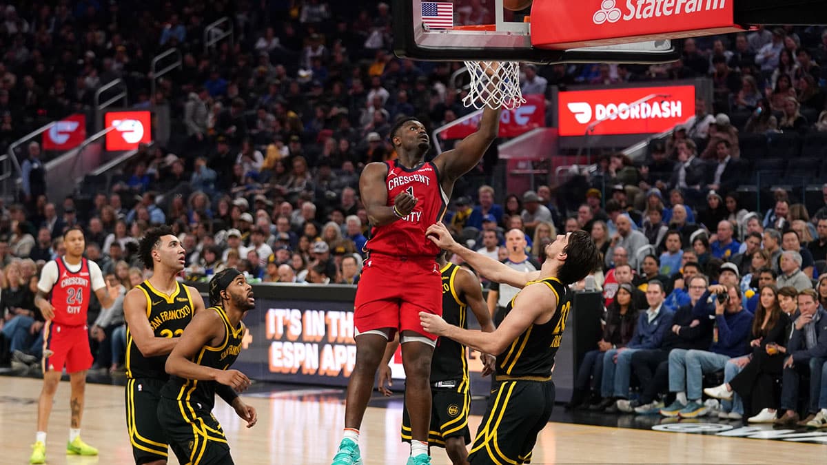 New Orleans Pelicans forward Zion Williamson (1) makes a shot over Golden State Warriors forward Dario Saric (20) in the fourth quarter at the Chase Center. 