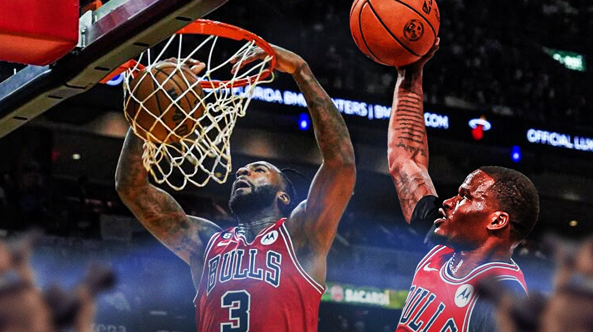 Bulls' Torrey Craig, Bulls' Andre Drummond both dunking a basketball on the same basket.