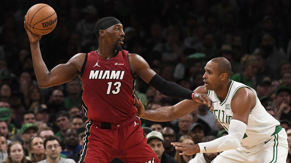 Miami Heat center Bam Adebayo controls the ball as Boston Celtics center Al Horford (42) defends during the second half in game one of the first round for the 2024 NBA playoffs at TD Garden