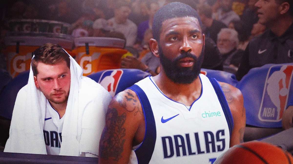 Mavericks' Luka Doncic sitting down on an NBA bench/sideline on left looking upset. Mavericks' Kyrie Irving on right standing up looking serious.