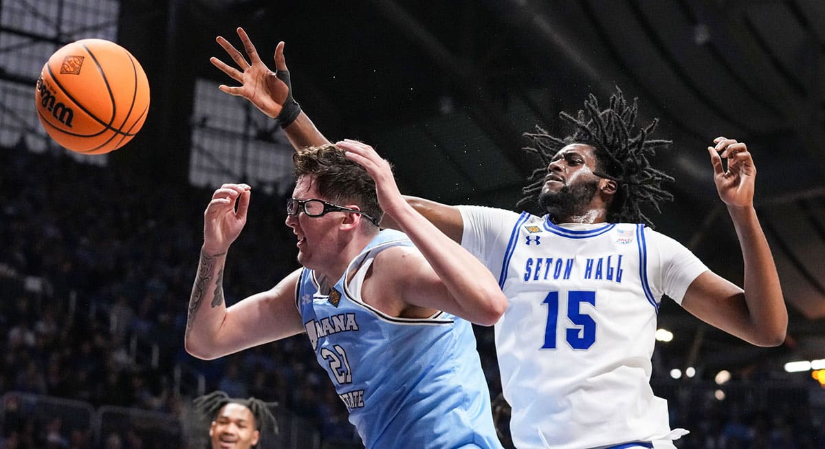 Seton Hall Pirates center Jaden Bediako (15) and Indiana State Sycamores center Robbie Avila (21) battle for a rebound Thursday, April 4, 2024, during the NIT championship game