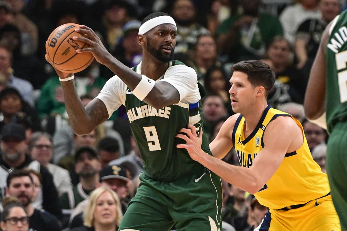 Milwaukee Bucks player Bobby Portis guarded by Indiana Pacers player Doug McDermott