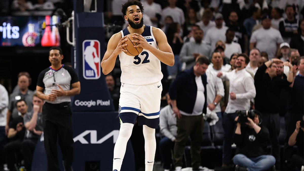 Minnesota Timberwolves center Karl-Anthony Towns (32) reacts after being charged with a foul against the Denver Nuggets during overtime of game four of the 2023 NBA Playoffs at Target Center.