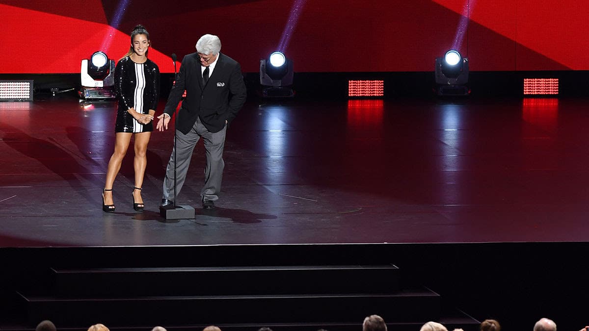 Olympic gymnast Aly Raisman and former hockey player Marcel Dionne present the Lady Byng Trophy during the 2017 NHL Awards and Expansion Draft at T-Mobile Arena. 