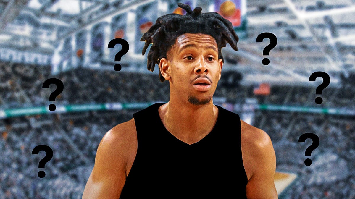 Former Michigan State player AJ Hoggard in a blank jersey with a question mark on it.